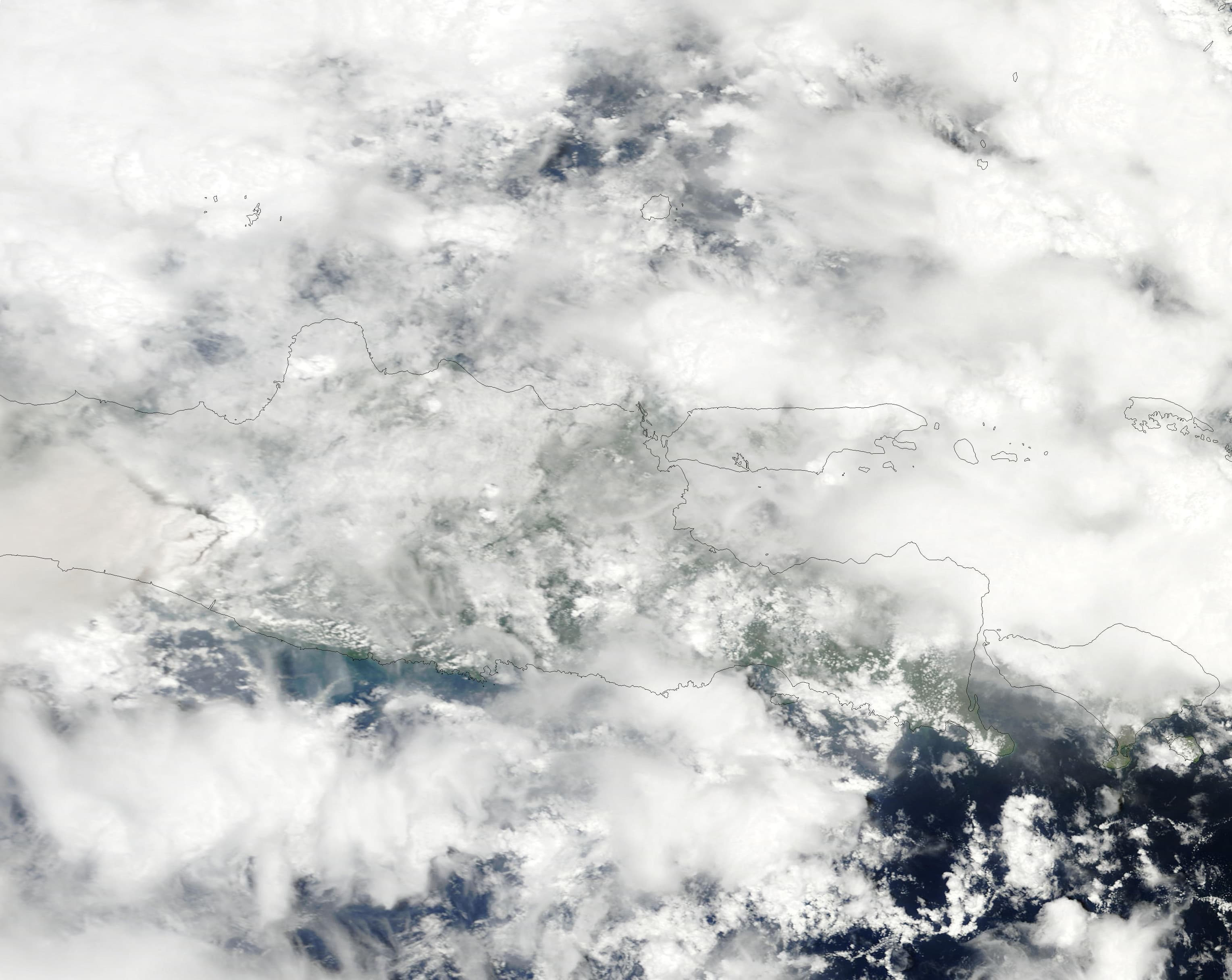 Signs of the eruption at Mount Merapi managed to puncture the persistent cloud cover over Java on November 5, 2010 when this natural-colour image was 